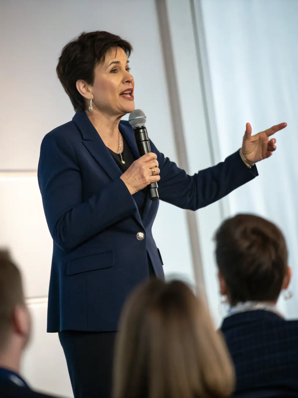 A person confidently presenting to a group, showcasing effective communication skills and a strong understanding of their audience, emphasizing public speaking and influence.